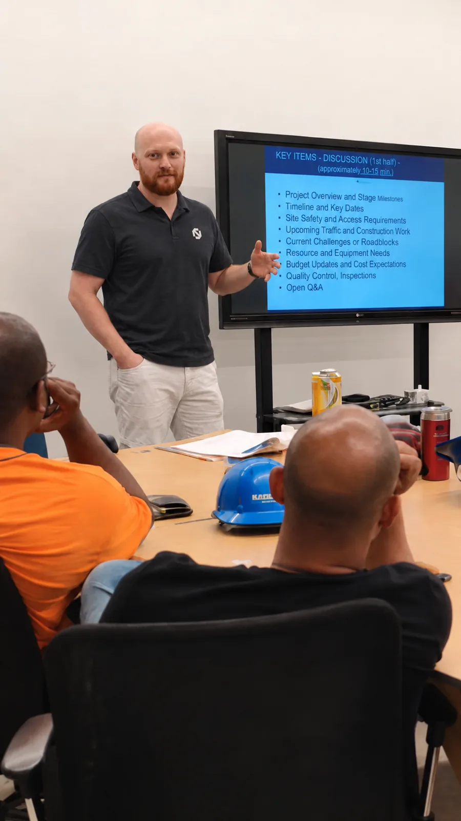 A Bidlo kickoff session: a customer crew in a training room with the rollout agenda on screen